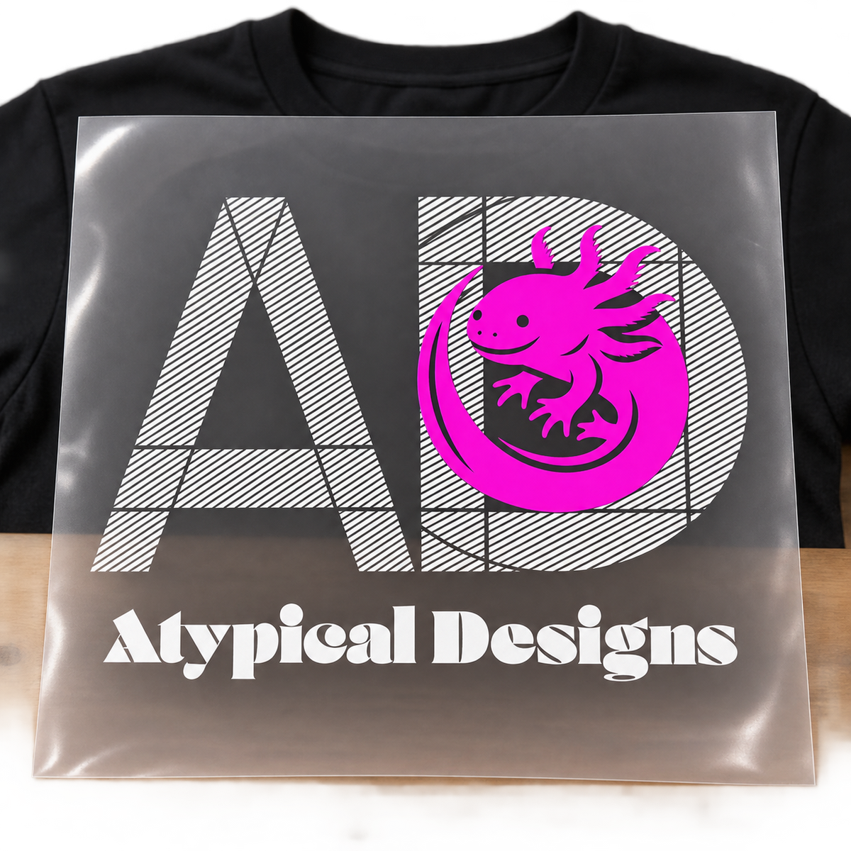 Custom DTF Graphic Transfer 11 × 11 in mockup featuring Atypical Designs logo on carrier film