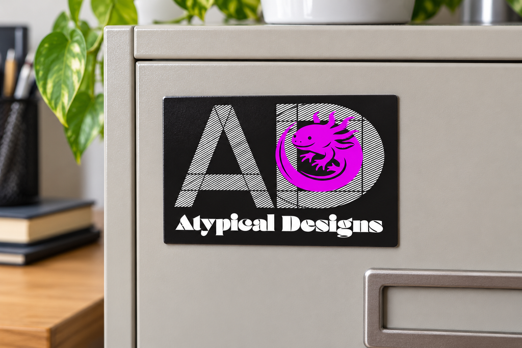 Custom Printed Magnets 4 × 6 in mockup with Atypical Designs logo on filing cabinet